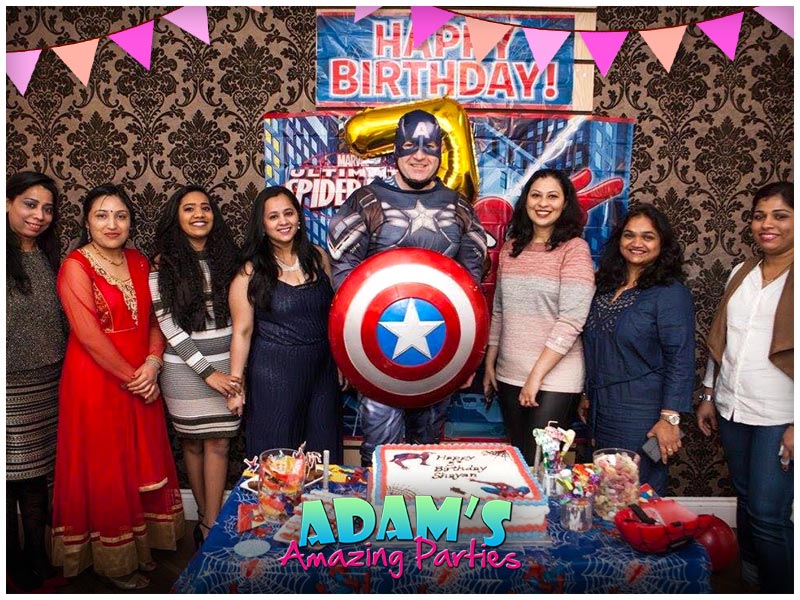 Captain America standing with Family at a birthday party